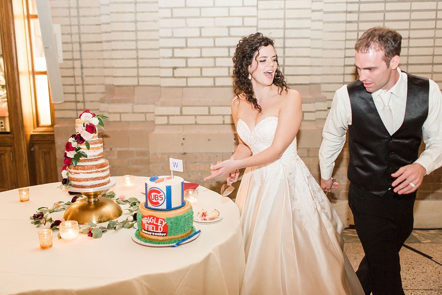 Arielle Peters Photography | Bride and groom cutting wedding cake at wedding reception at Baker Street Train Station in Fort Wayne, Indiana.