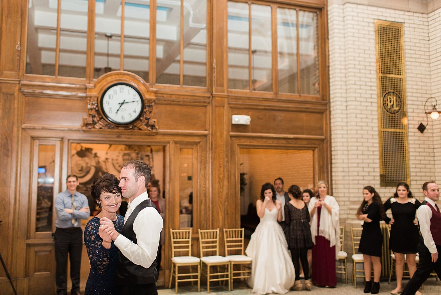Arielle Peters Photography | Mother of groom and groom dancing at wedding reception at Baker Street Train Station in Fort Wayne, Indiana.