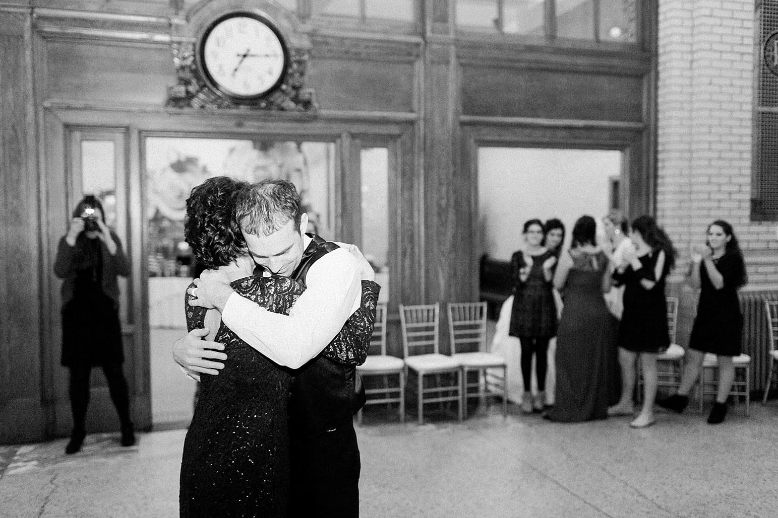 Arielle Peters Photography | Mother of groom and groom dancing at wedding reception at Baker Street Train Station in Fort Wayne, Indiana.