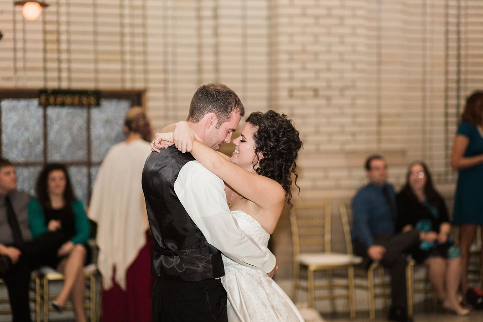 Arielle Peters Photography | Bride and groom sharing first dance at wedding reception at Baker Street Train Station in Fort Wayne, Indiana.