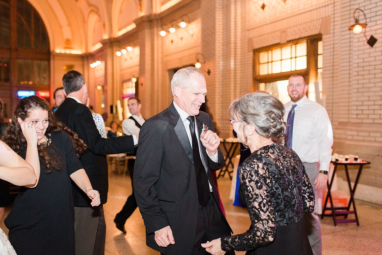 Arielle Peters Photography | Wedding guests dancing at wedding reception at Baker Street Train Station in Fort Wayne, Indiana.