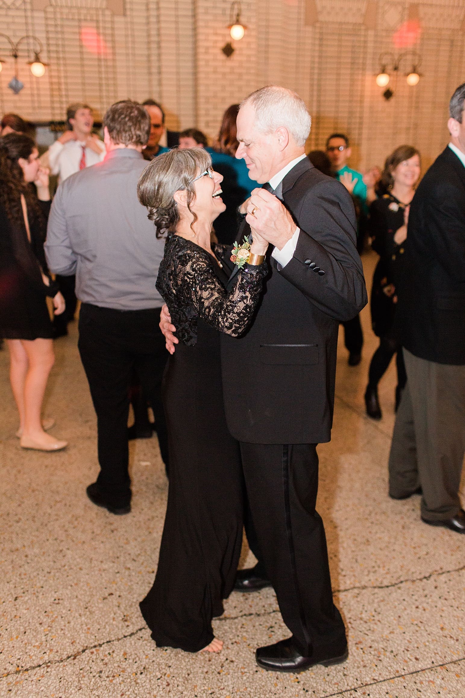 Arielle Peters Photography | Wedding guests dancing at wedding reception at Baker Street Train Station in Fort Wayne, Indiana.