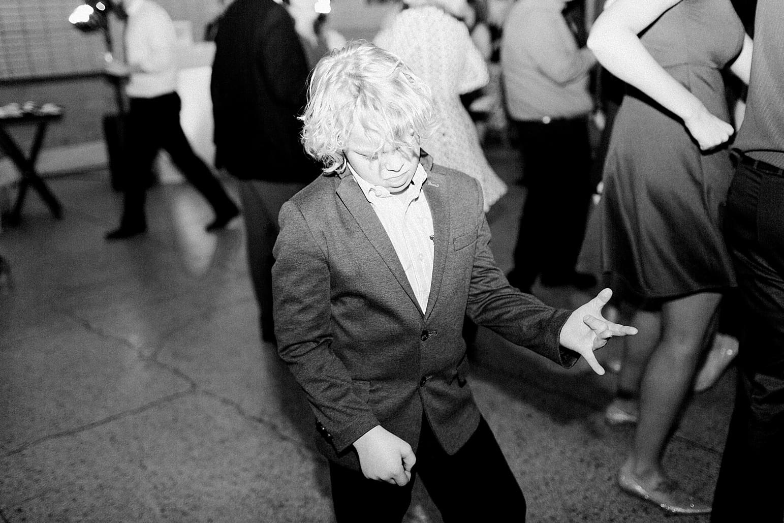 Arielle Peters Photography | Young kid dancing at wedding reception at Baker Street Train Station in Fort Wayne, Indiana.
