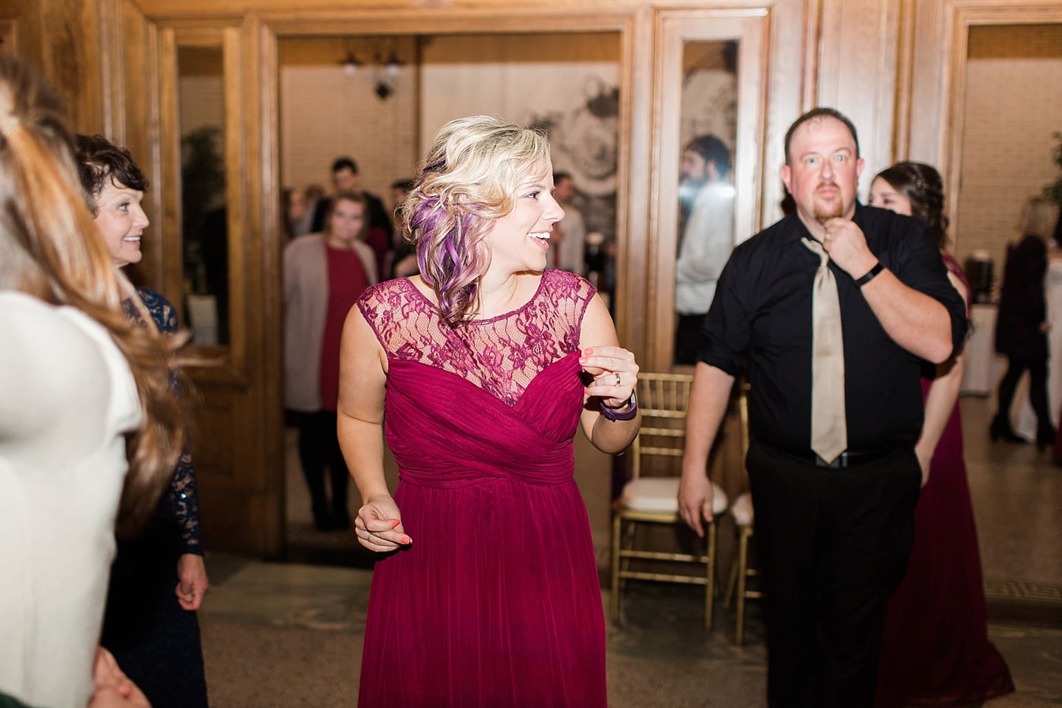 Arielle Peters Photography | Bride and groom laughing and dancing at wedding reception at Baker Street Train Station in Fort Wayne, Indiana.