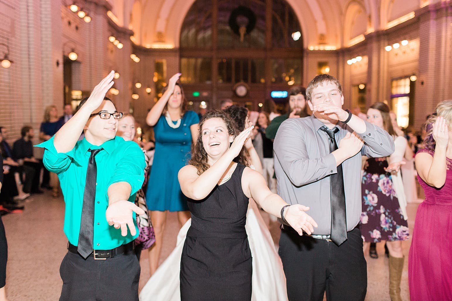 Arielle Peters Photography | Wedding guests dancing at wedding reception at Baker Street Train Station in Fort Wayne, Indiana.