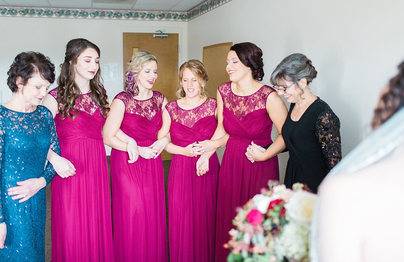 Arielle Peters Photography | Bride and bridesmaids having first reveal on wedding day at Baker Street Train Station in Fort Wayne, Indiana.