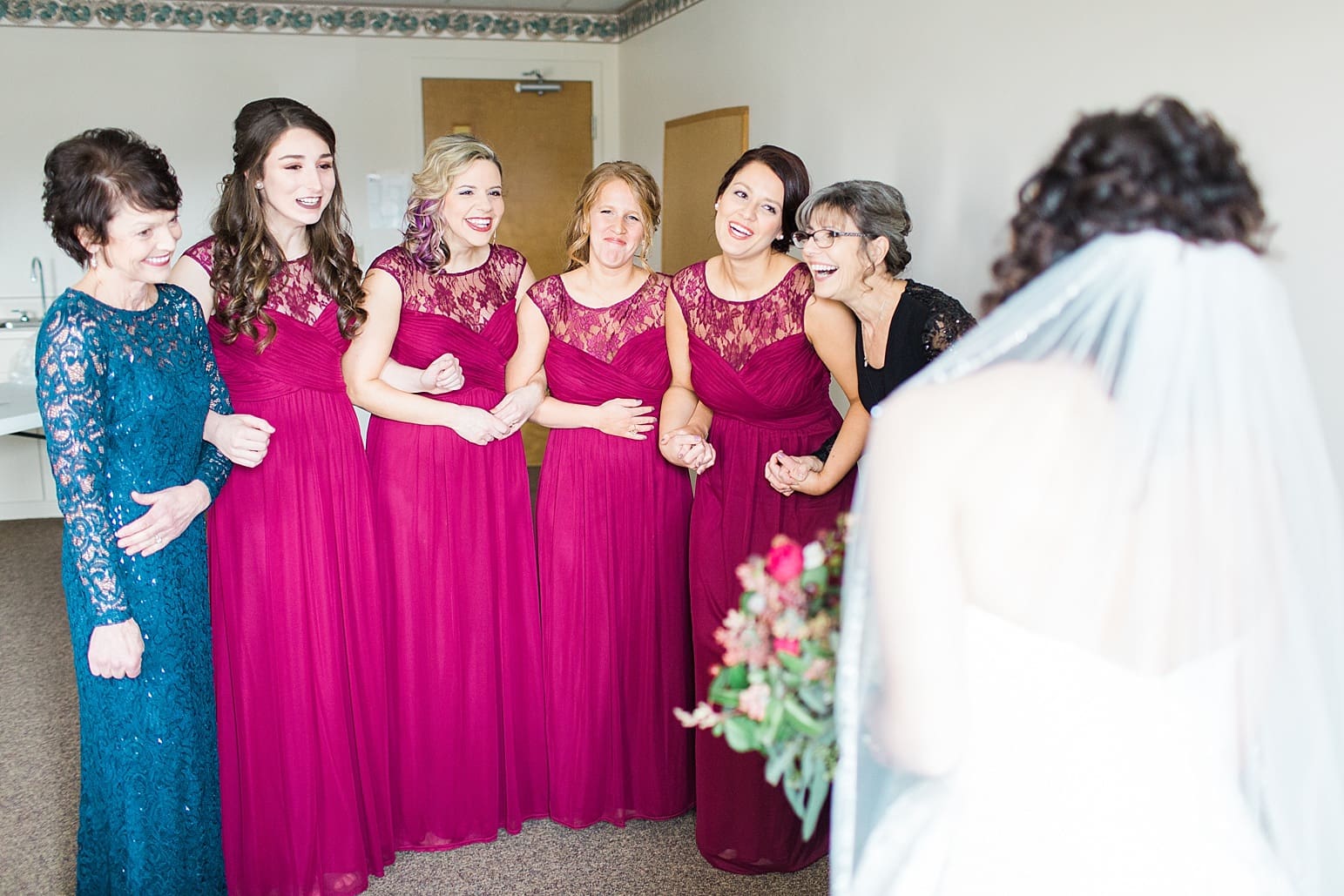 Arielle Peters Photography | Bride and bridesmaids having first reveal on wedding day at Baker Street Train Station in Fort Wayne, Indiana.