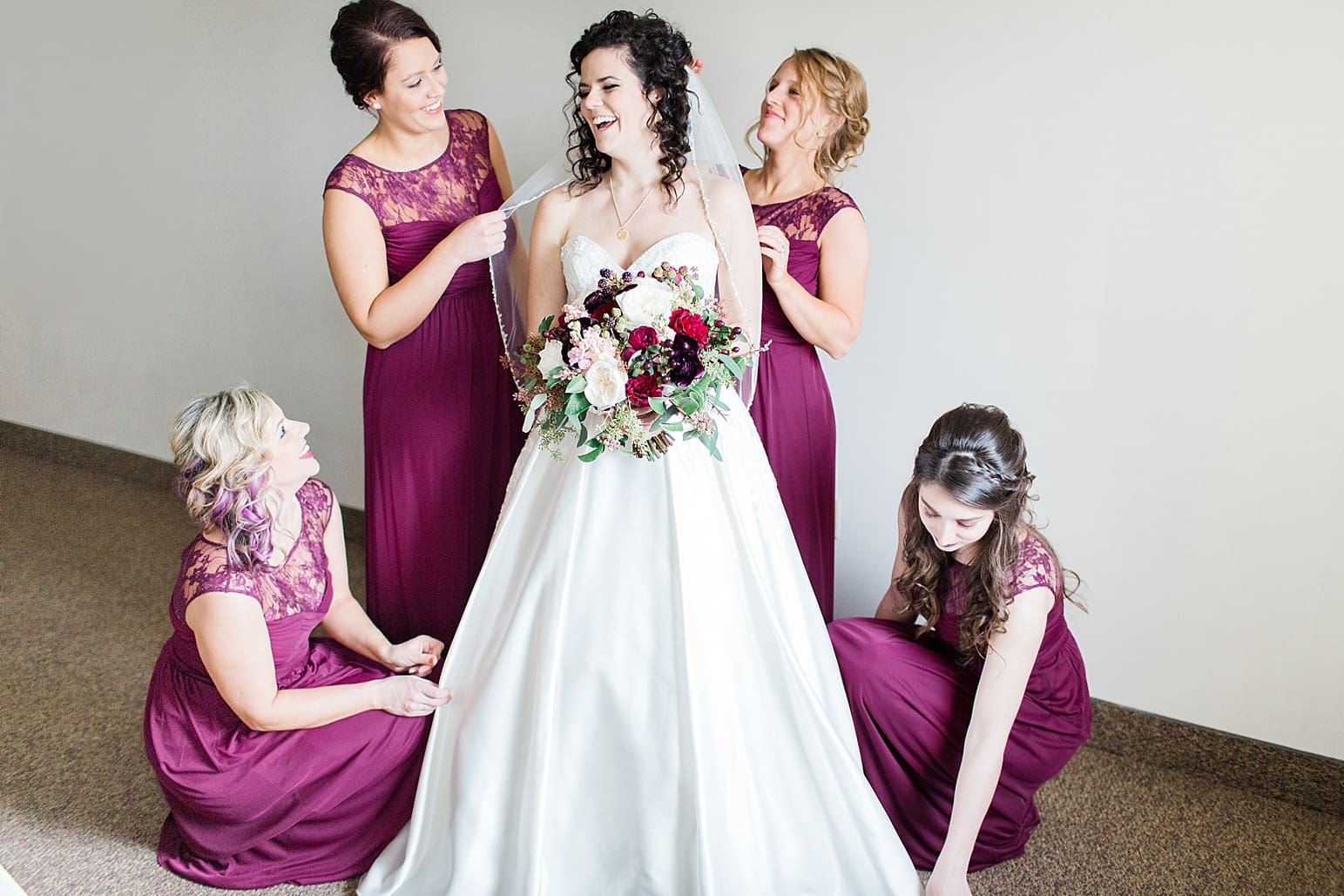 Arielle Peters Photography | Bride and bridesmaids having first reveal on wedding day at Baker Street Train Station in Fort Wayne, Indiana.