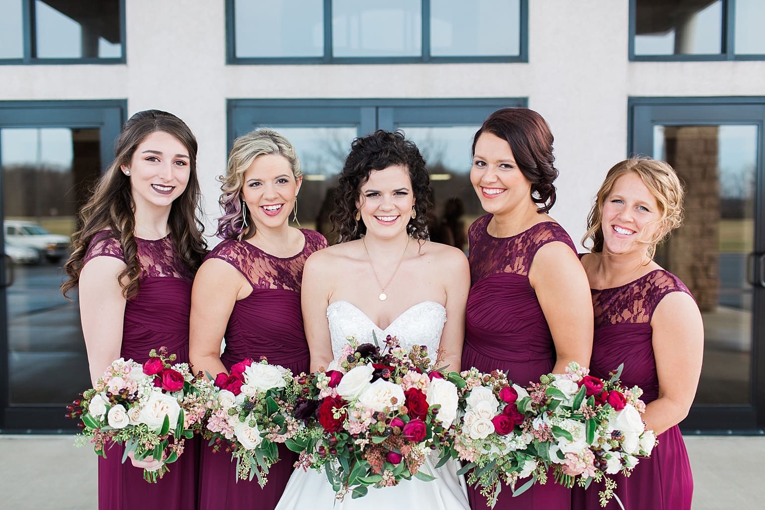 Arielle Peters Photography | Bride and bridesmaids outside train station on wedding day at Baker Street Train Station in Fort Wayne, Indiana.