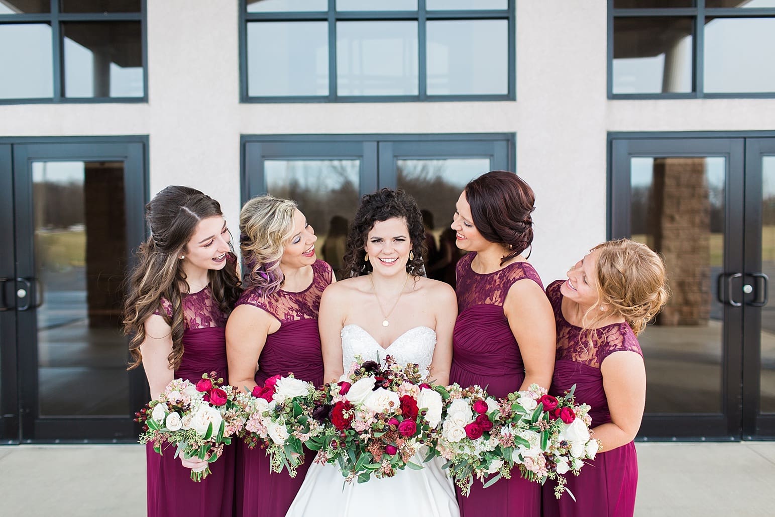 Arielle Peters Photography | Bride and bridesmaids outside train station on wedding day at Baker Street Train Station in Fort Wayne, Indiana.