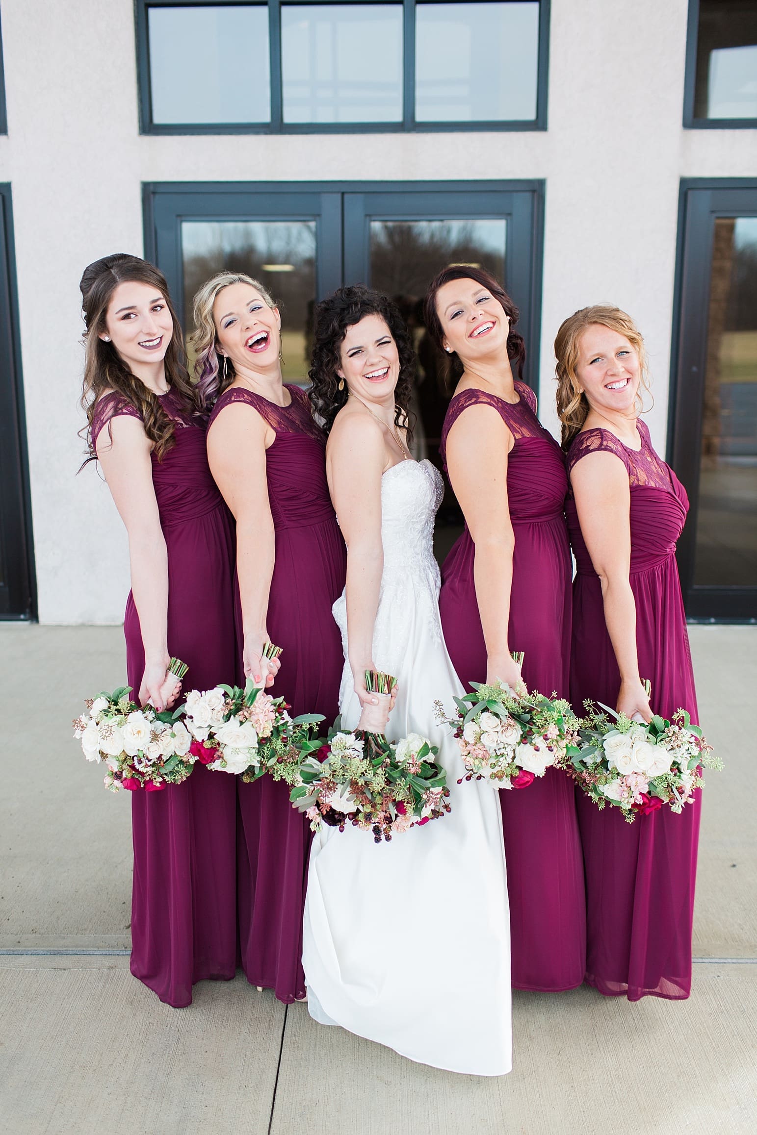 Arielle Peters Photography | Bride and bridesmaids outside train station on wedding day at Baker Street Train Station in Fort Wayne, Indiana.