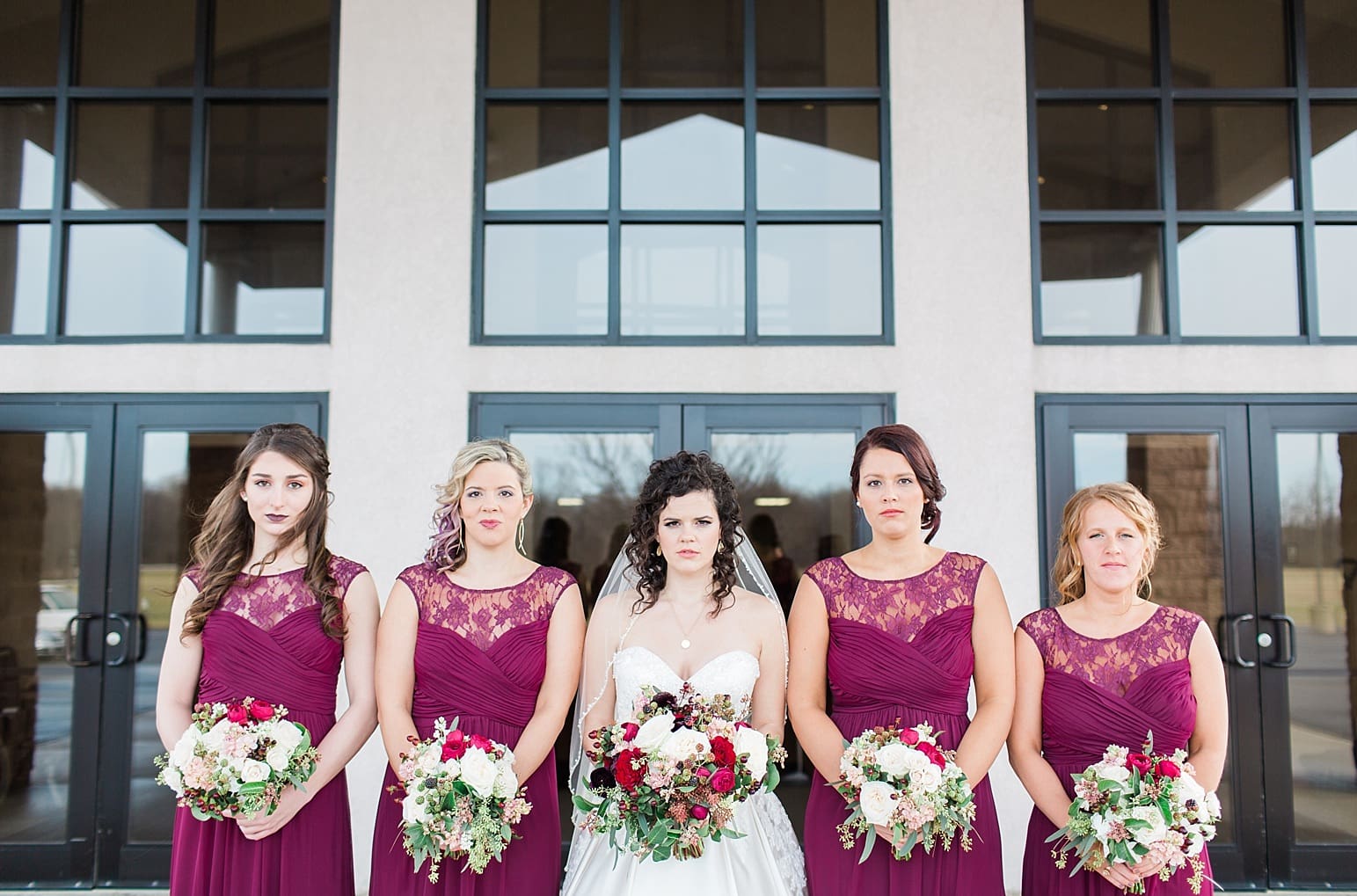 Arielle Peters Photography | Bride and bridesmaids outside train station on wedding day at Baker Street Train Station in Fort Wayne, Indiana.