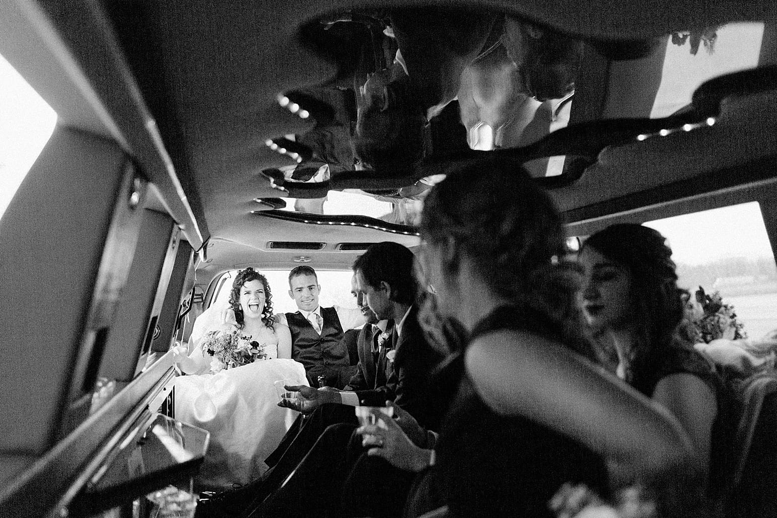 Arielle Peters Photography | Wedding party in party limo on wedding day at Baker Street Train Station in Fort Wayne, Indiana.