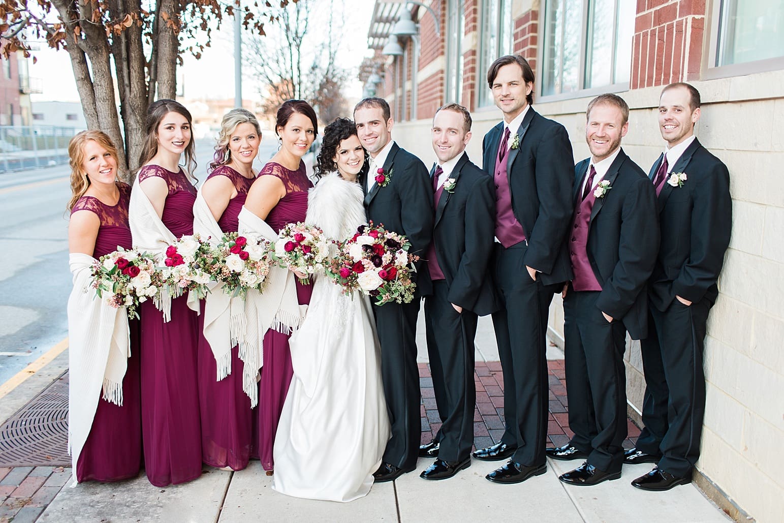 Arielle Peters Photography | Wedding party on city streets on wedding day at Baker Street Train Station in Fort Wayne, Indiana.