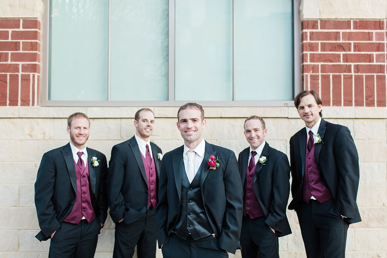 Arielle Peters Photography | Groom and groomsmen on city streets on wedding day at Baker Street Train Station in Fort Wayne, Indiana.