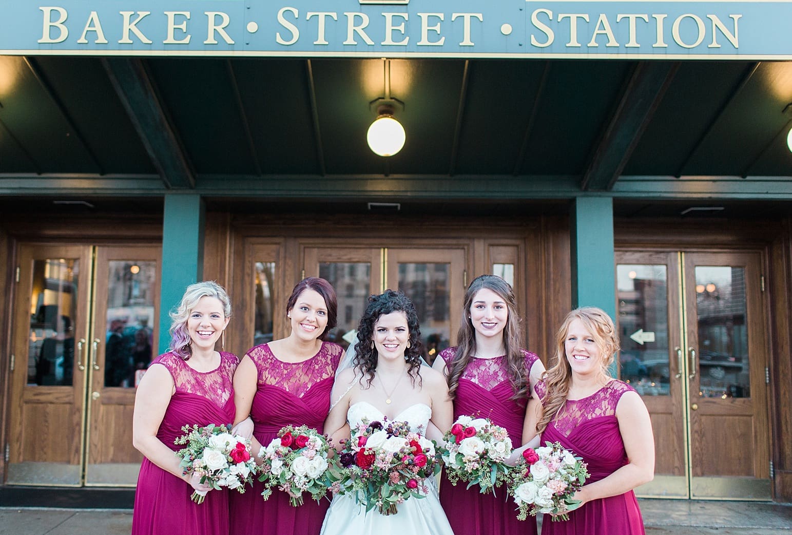 Arielle Peters Photography | Bride and bridesmaids on wedding day outside Baker Street Train Station in Fort Wayne, Indiana.