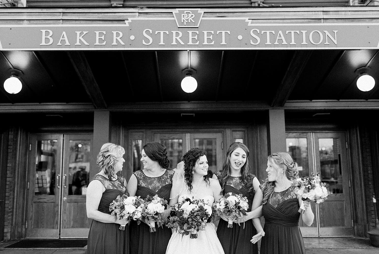 Arielle Peters Photography | Bride and bridesmaids on wedding day outside Baker Street Train Station in Fort Wayne, Indiana.