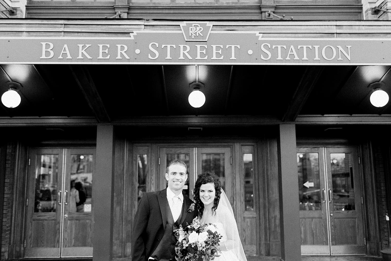 Arielle Peters Photography | Bride and groom on wedding day outside Baker Street Train Station in Fort Wayne, Indiana.