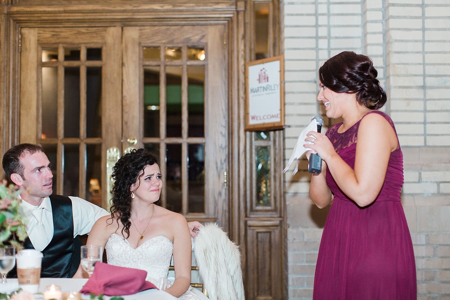 Arielle Peters Photography | Maid of honor giving toast at wedding reception at Baker Street Train Station in Fort Wayne, Indiana.