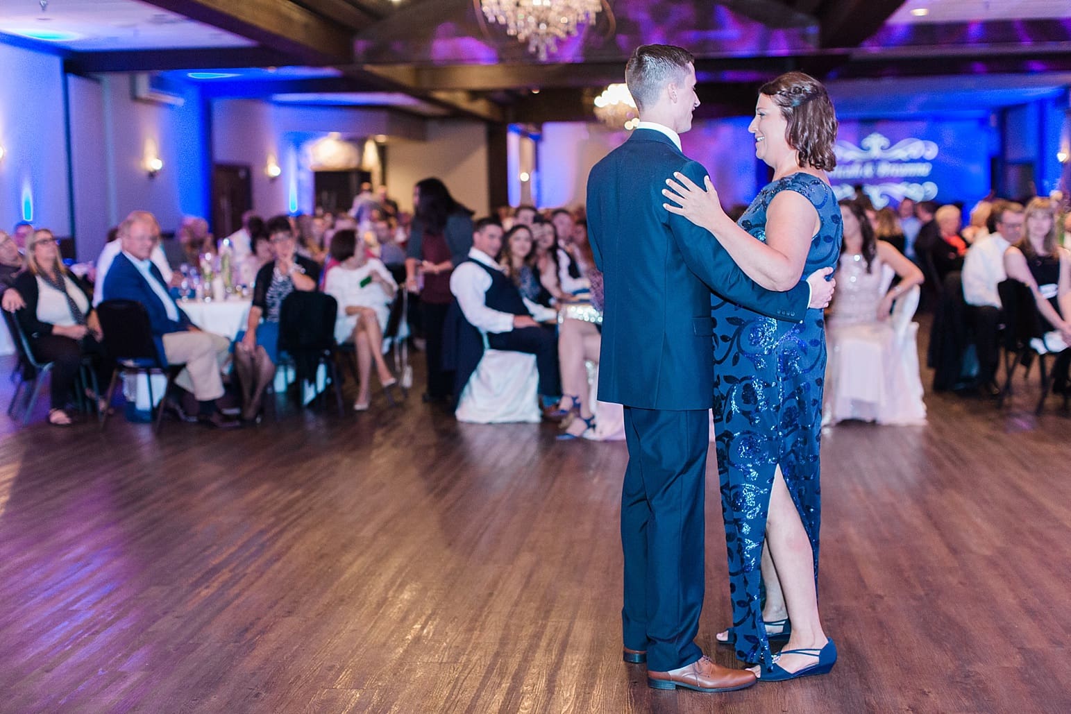 Arielle Peters Photography | Mother of groom and groom sharing dance at wedding reception at The Market in Valparaiso, Indiana.