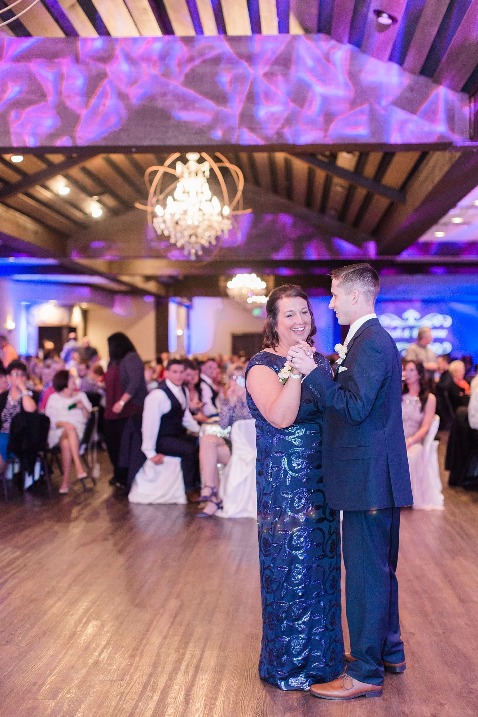 Arielle Peters Photography | Mother of groom and groom sharing dance at wedding reception at The Market in Valparaiso, Indiana.