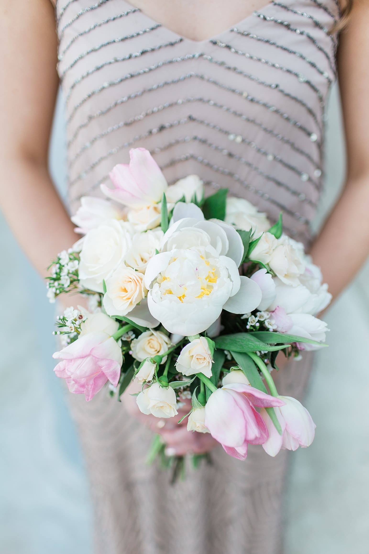 Arielle Peters Photography | Bridesmaid holding bouquet on wedding day at The Market in Valparaiso, Indiana.