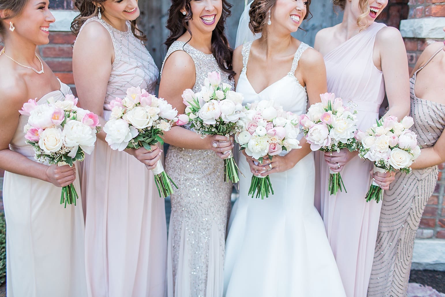 Arielle Peters Photography | Bride and bridesmaids in front of old wood doors on wedding day at The Market in Valparaiso, Indiana.