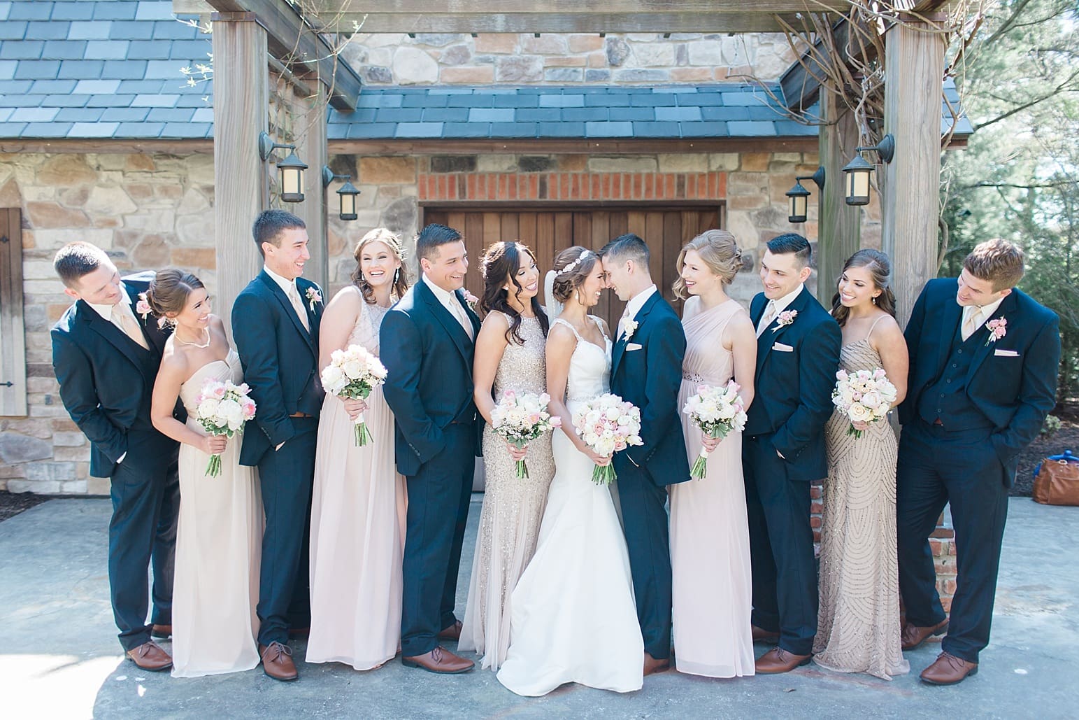 Arielle Peters Photography | Wedding party under large wooden pergola on wedding day at The Market in Valparaiso, Indiana.