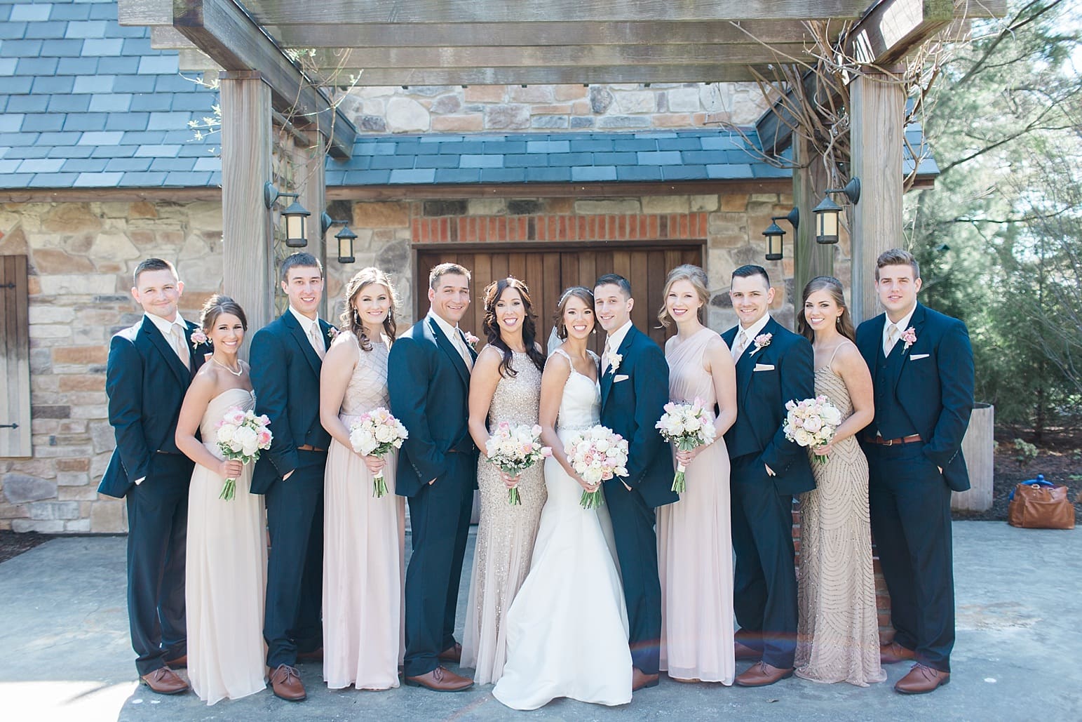 Arielle Peters Photography | Wedding party under old wooden pergola on wedding day at The Market in Valparaiso, Indiana.