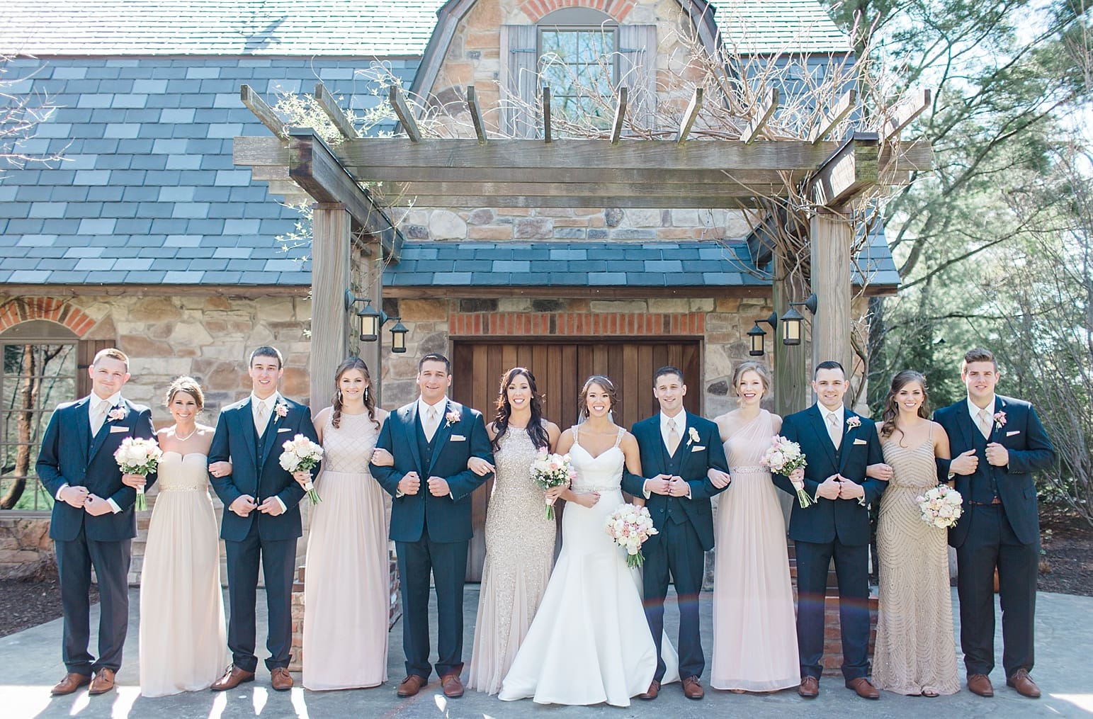 Arielle Peters Photography | Wedding party under old wooden pergola on wedding day at The Market in Valparaiso, Indiana.