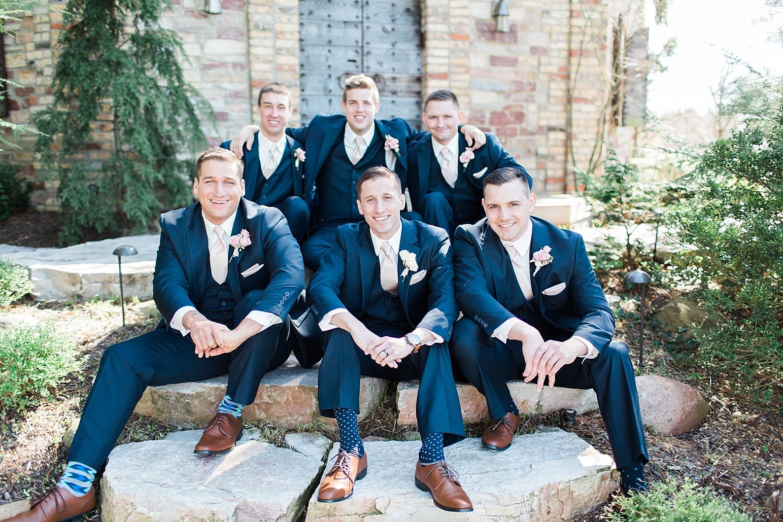 Arielle Peters Photography | Groom and groomsmen on old stone steps in garden on wedding day at The Market in Valparaiso, Indiana.