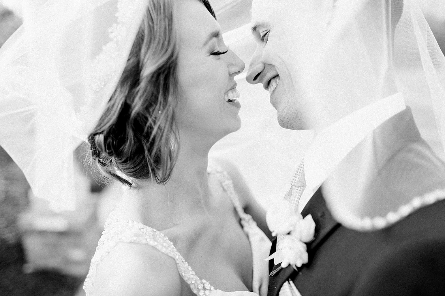 Arielle Peters Photography | Bride and groom under bride's veil on wedding day at The Market in Valparaiso, Indiana.