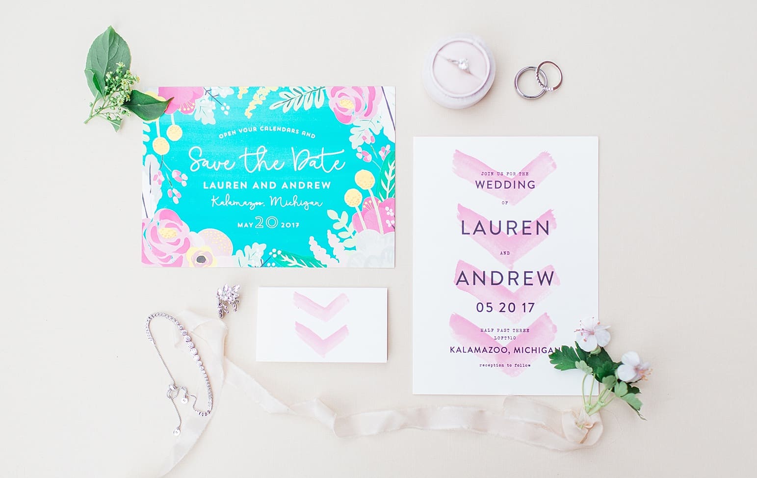 Arielle Peters Photography | Wedding invitations and jewelry on wedding day at Loft 310 in Kalamazoo, Michigan.