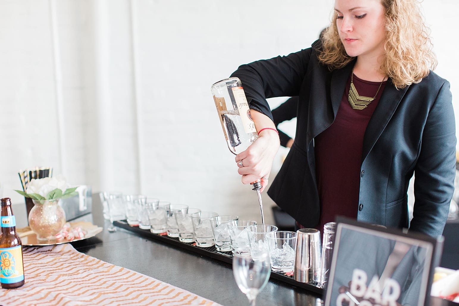 Arielle Peters Photography | Wedding reception table settings and bar on wedding day at Loft 310 in Kalamazoo, Michigan.