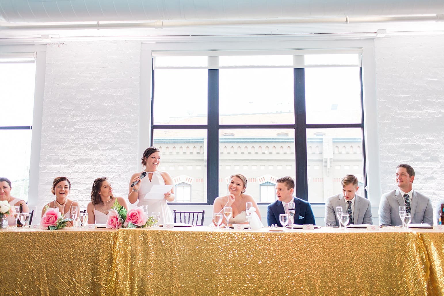 Arielle Peters Photography | Maid of honor giving toast at wedding reception at Loft 310 in Kalamazoo, Michigan.