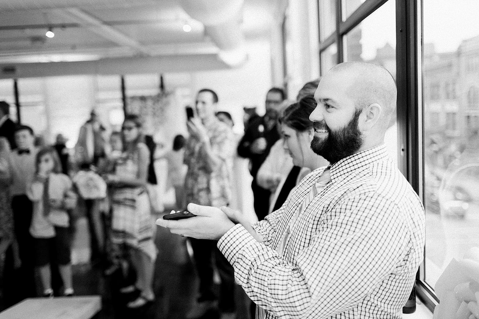 Arielle Peters Photography | Wedding guests clapping at wedding reception at Loft 310 in Kalamazoo, Michigan.