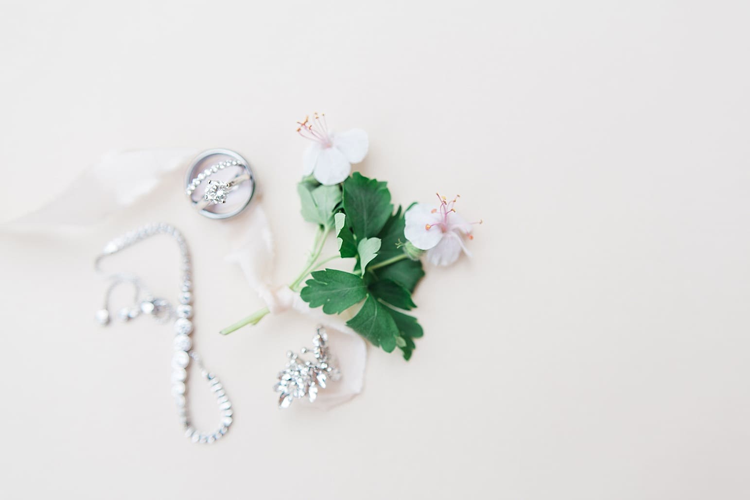 Arielle Peters Photography | Wedding rings and jewelry on wedding day at Loft 310 in Kalamazoo, Michigan.