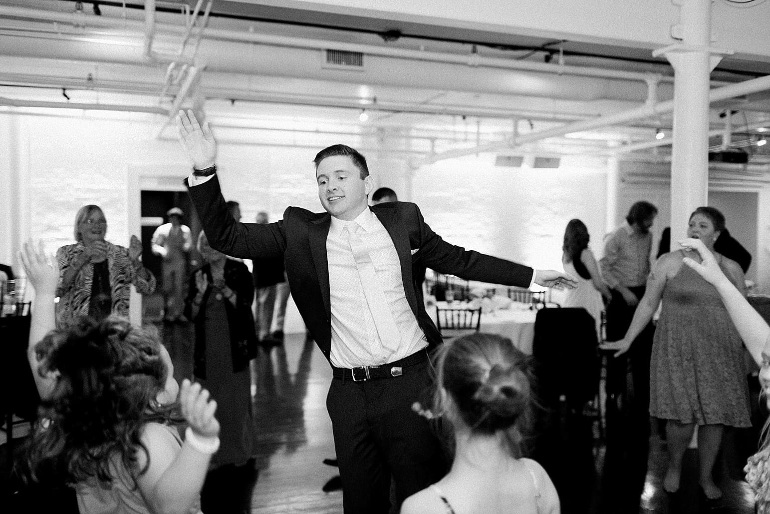 Arielle Peters Photography | Groom dancing with kids at wedding reception at Loft 310 in Kalamazoo, Michigan.