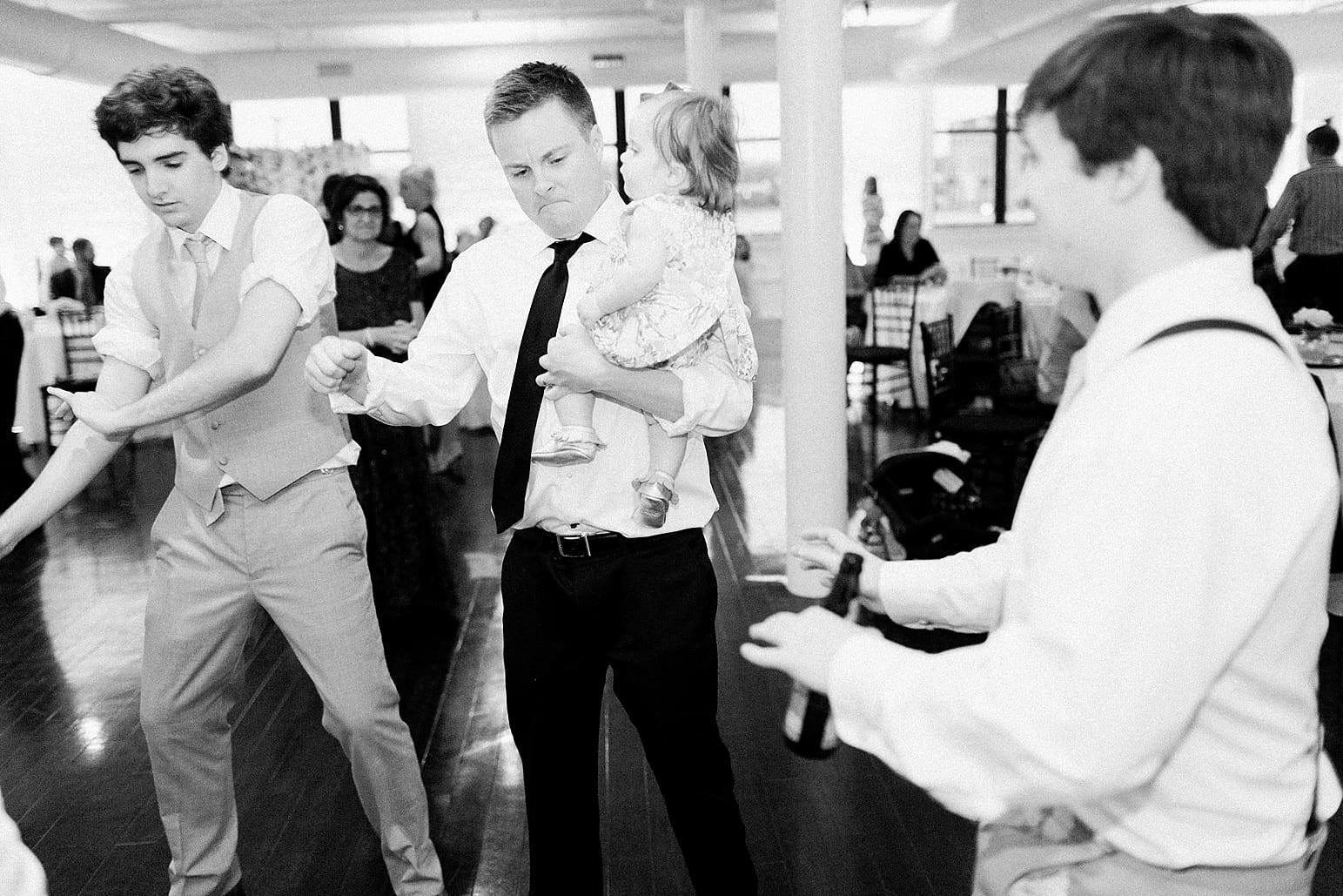 Arielle Peters Photography | Wedding guests dancing at wedding reception at Loft 310 in Kalamazoo, Michigan.