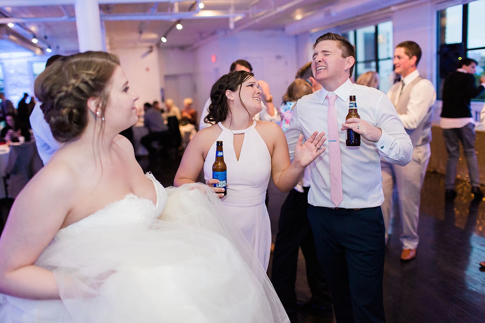 Arielle Peters Photography | Wedding guests singing and dancing at wedding reception at Loft 310 in Kalamazoo, Michigan.