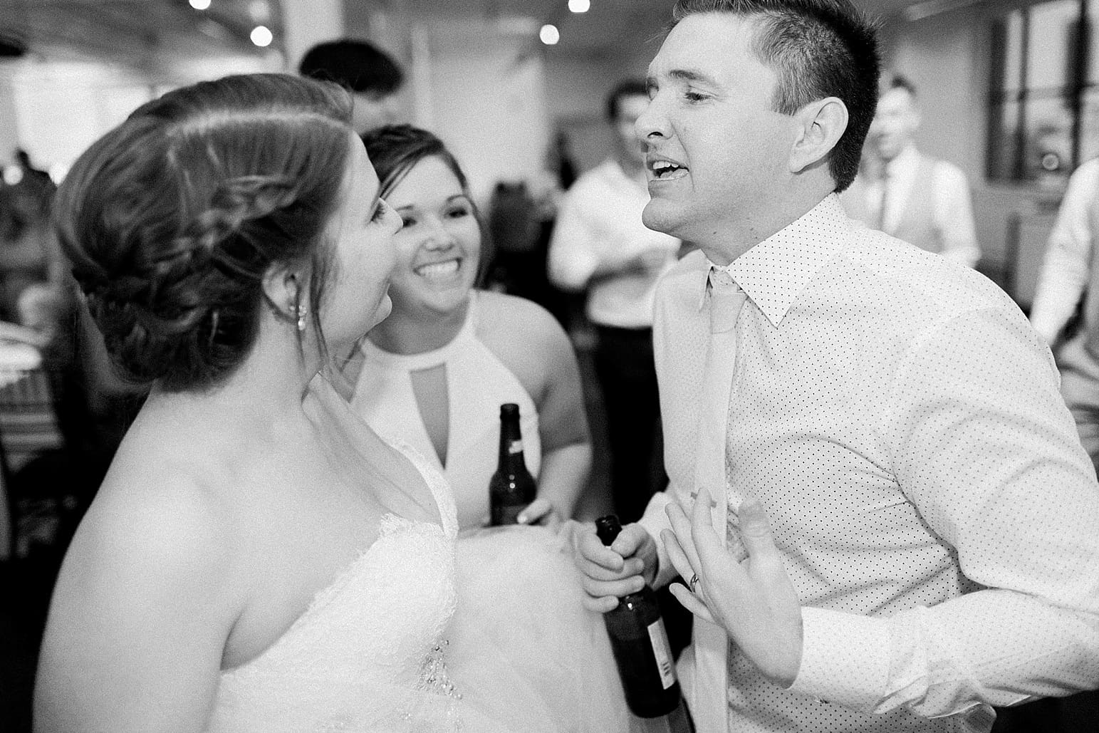 Arielle Peters Photography | Bride and groom dancing and singing at wedding reception at Loft 310 in Kalamazoo, Michigan.