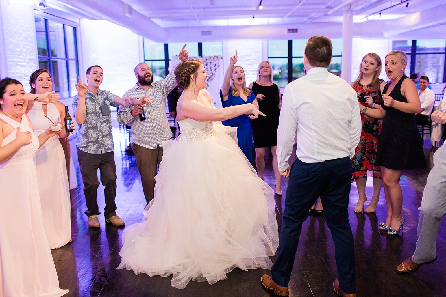 Arielle Peters Photography | Wedding guests dancing at wedding reception at Loft 310 in Kalamazoo, Michigan.