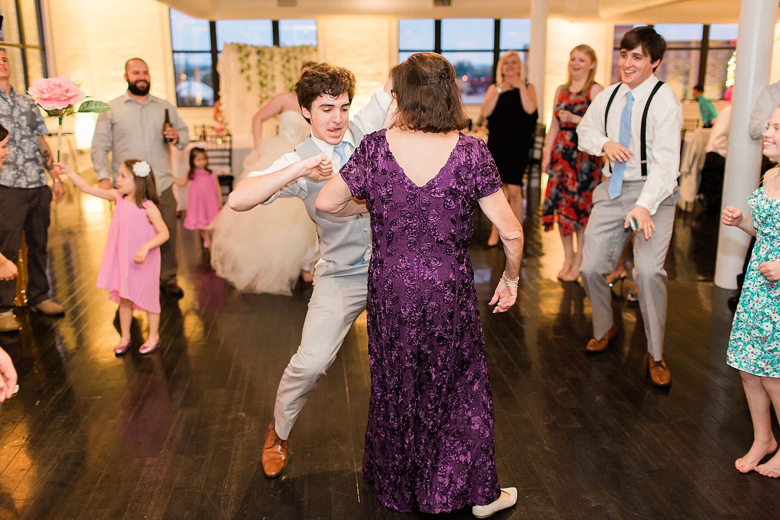 Arielle Peters Photography | Wedding guests dancing at wedding reception at Loft 310 in Kalamazoo, Michigan.