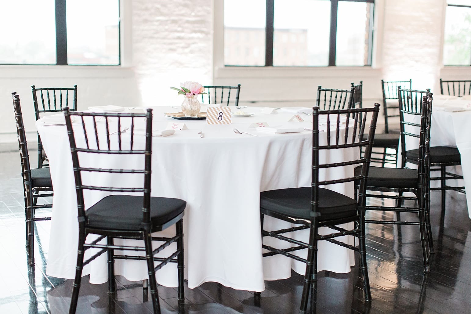 Arielle Peters Photography | Wedding reception table settings and floral arrangements on wedding day at Loft 310 in Kalamazoo, Michigan.