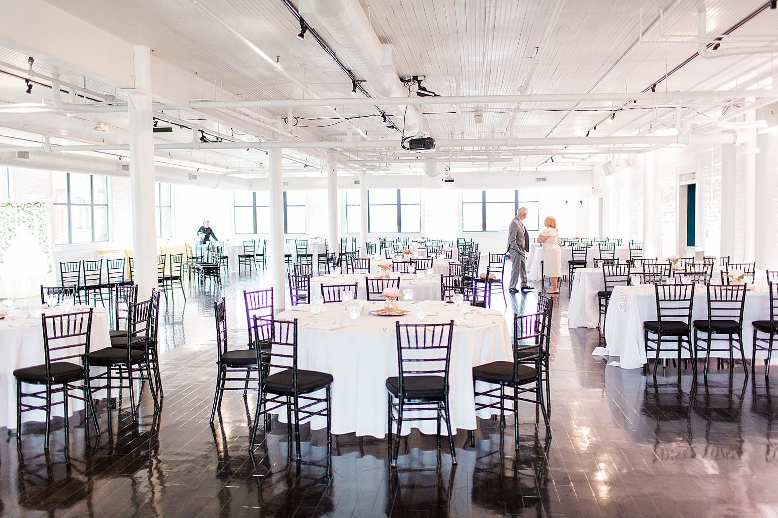 Arielle Peters Photography | Wedding reception table settings and floral arrangements on wedding day at Loft 310 in Kalamazoo, Michigan.
