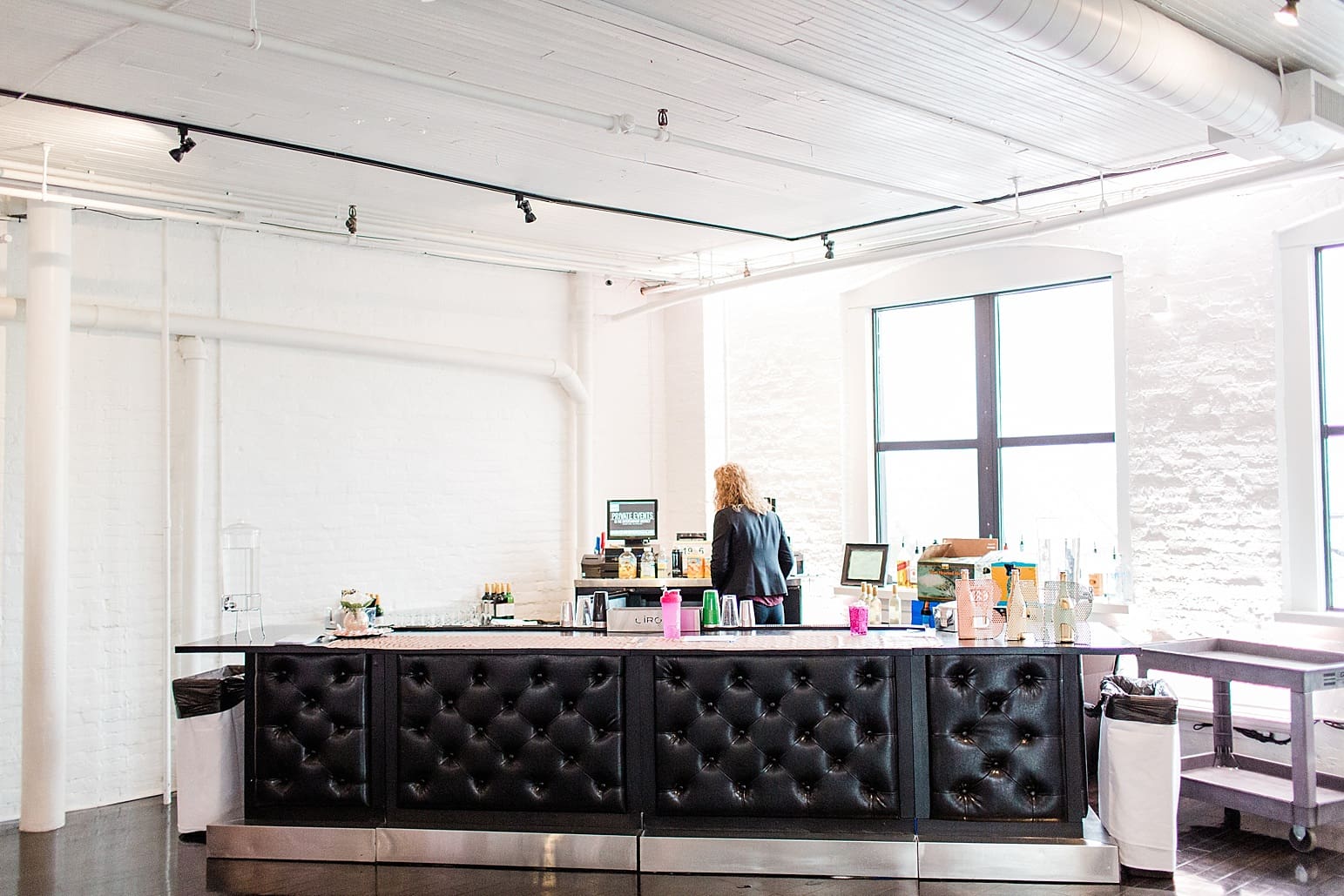 Arielle Peters Photography | Wedding reception table settings and floral arrangements on wedding day at Loft 310 in Kalamazoo, Michigan.