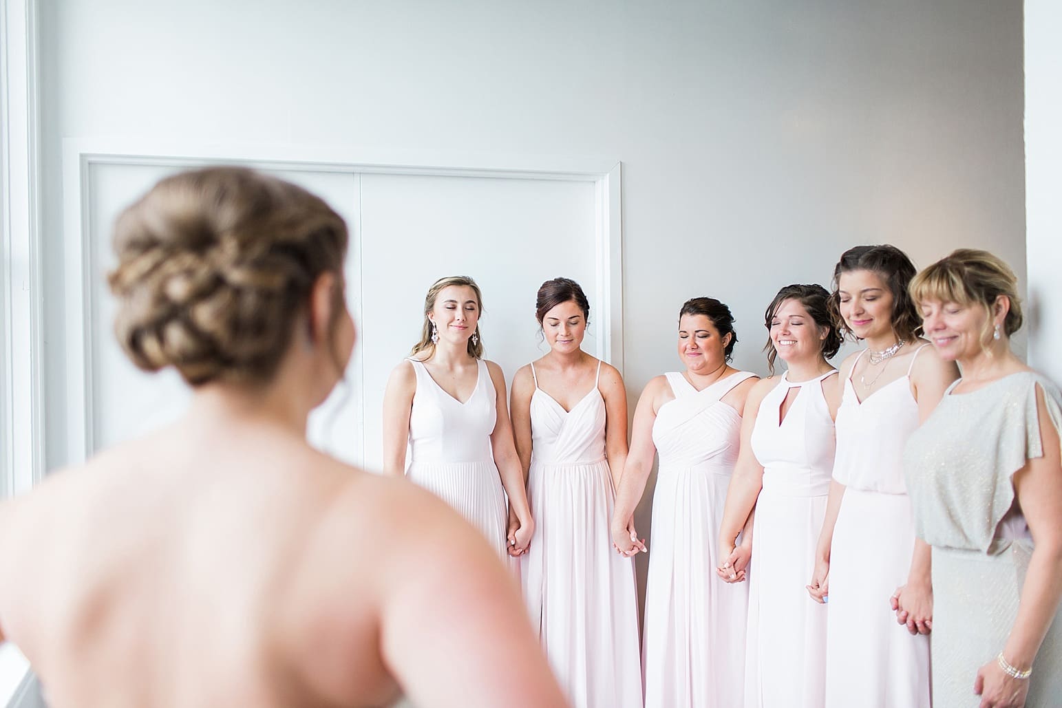 Arielle Peters Photography | Bride and bridesmaids having first reveal on wedding day at Loft 310 in Kalamazoo, Michigan.