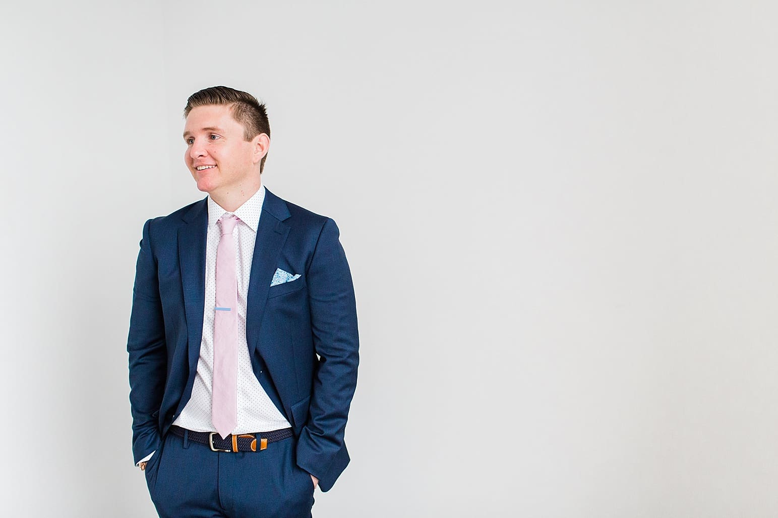 Arielle Peters Photography | Groom standing with hands in pockets on wedding day at Loft 310 in Kalamazoo, Michigan.