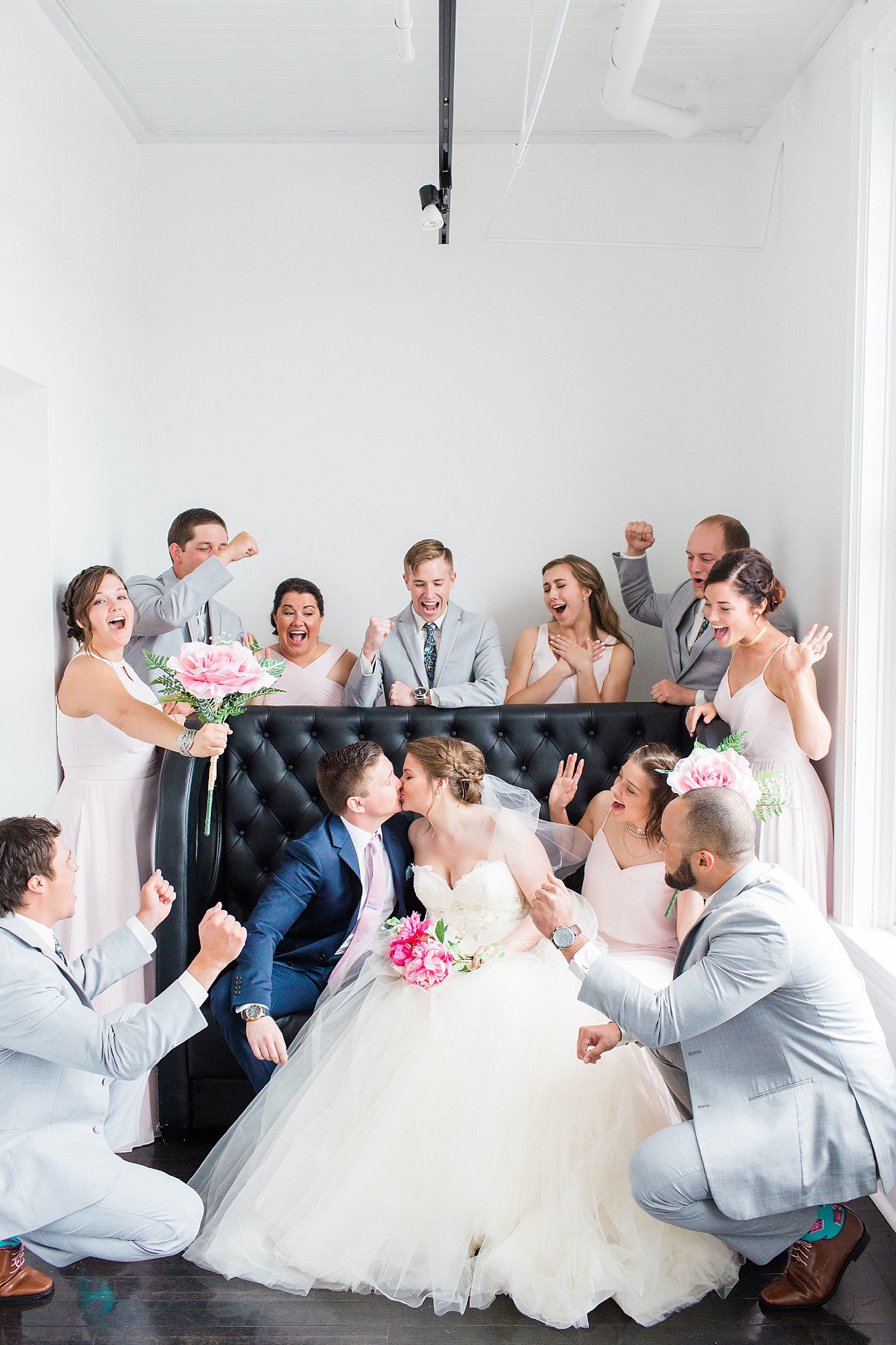 Arielle Peters Photography taking a couple’s wedding day photos at at Loft 310 in Kalamazoo, Michigan.