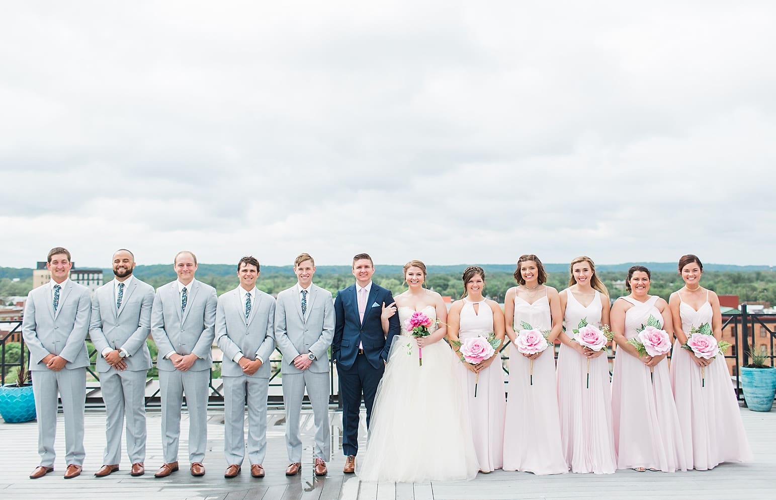 Arielle Peters Photography | Wedding party standing on rooftop terrace on wedding day at Loft 310 in Kalamazoo, Michigan.